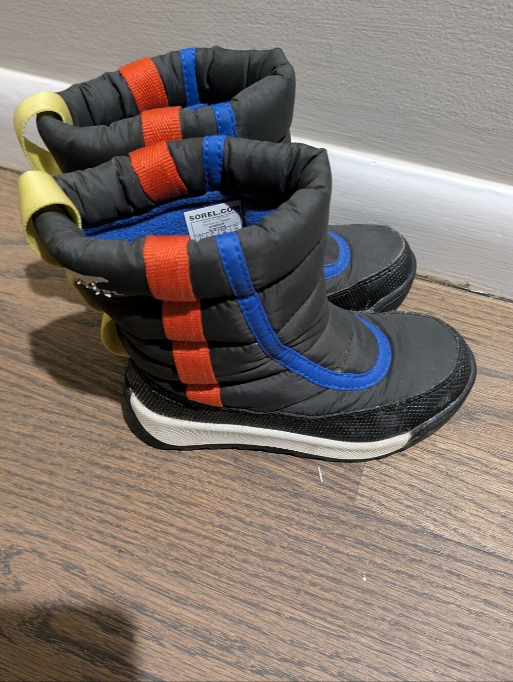 Sorel Kids Waterproof Black Winter Boots with Orange, Blue & Yellow Accents